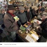 Long lines circled the Chagrin Hardware store as the community staged a "Cash Mob" of support.  Photo by Amy Sancetta, AP.